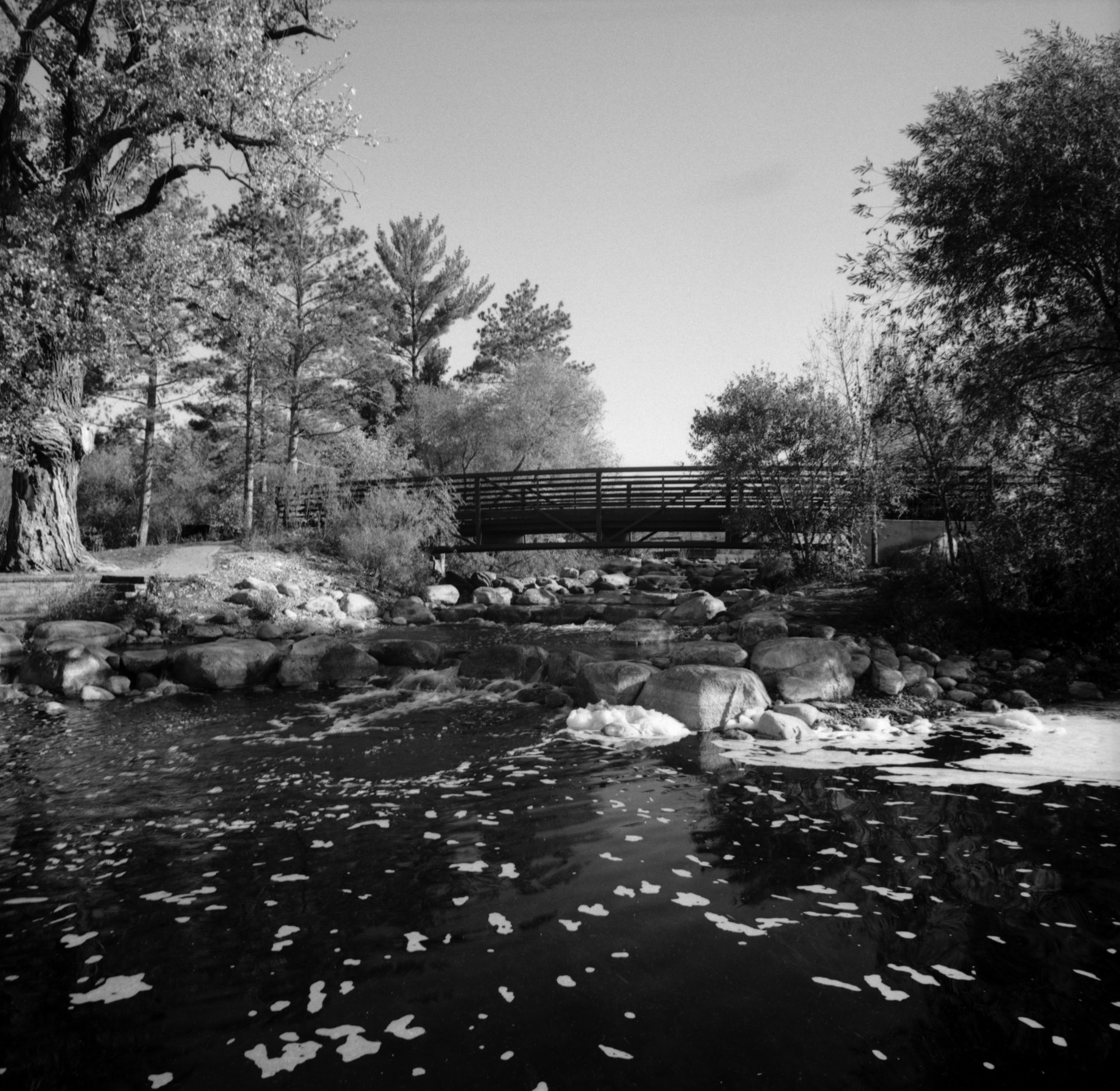 Bridge over stream in black and white (Pic: Aleks Usovich)