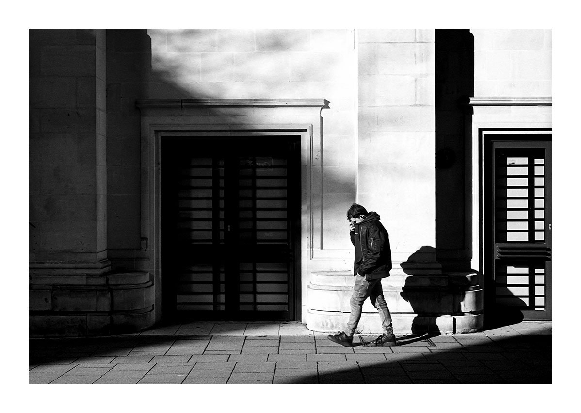 Man walking on shadowy street (Pic: Kevin Moore)