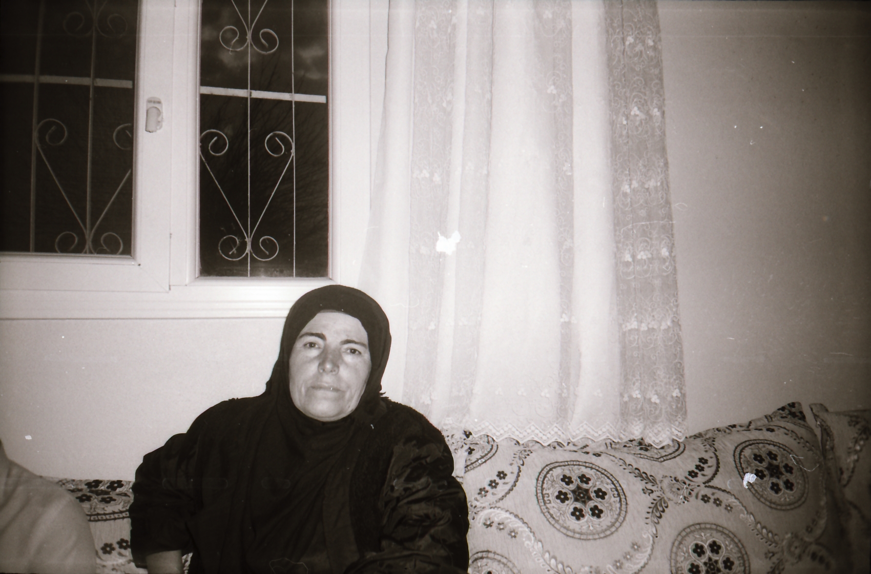 Woman in headscarf on sofa (Pic: Courtesy Sirkhane Darkroom)