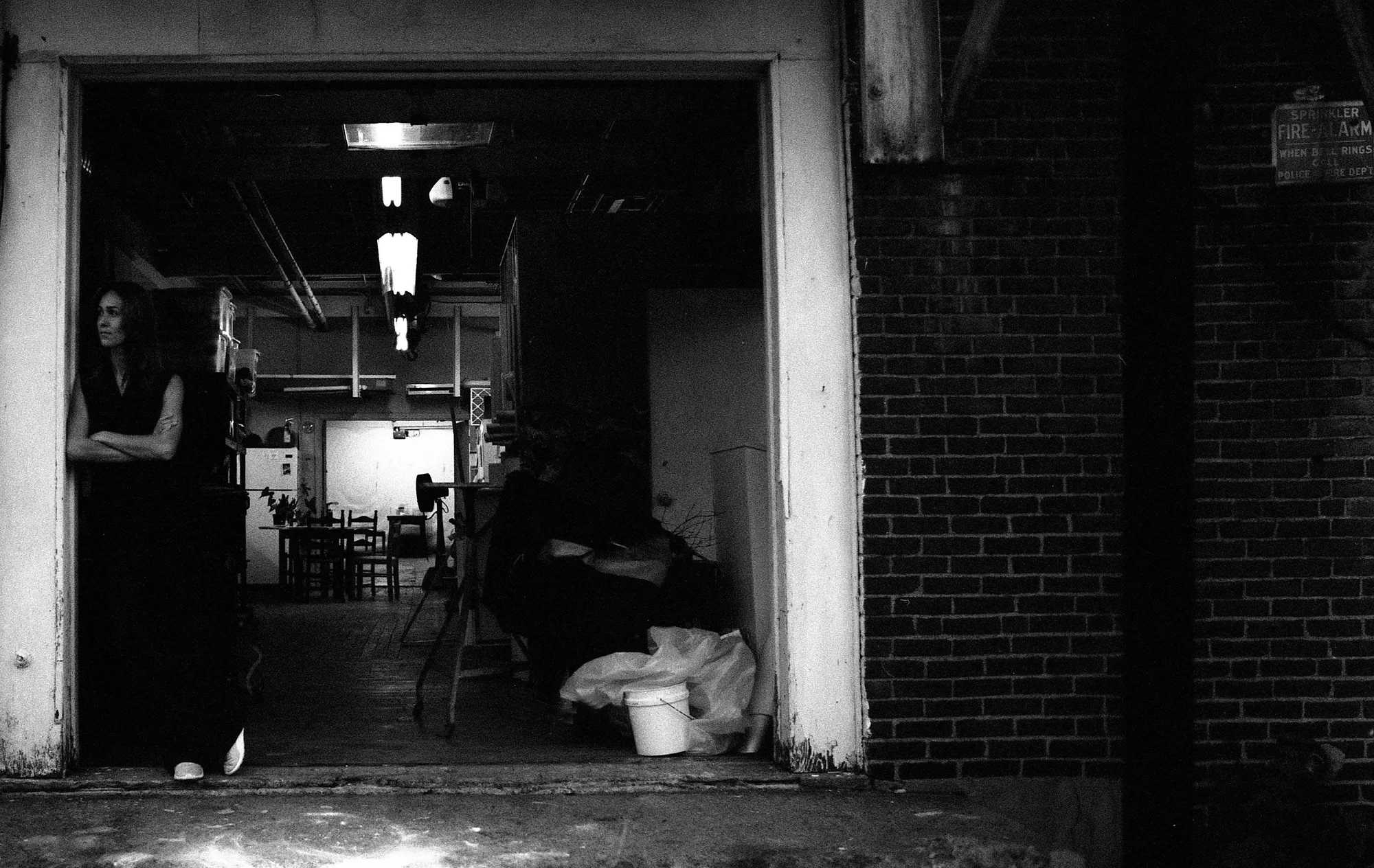 Woman leaning in doorway in low light (Pic: Courtesy CatLABS)