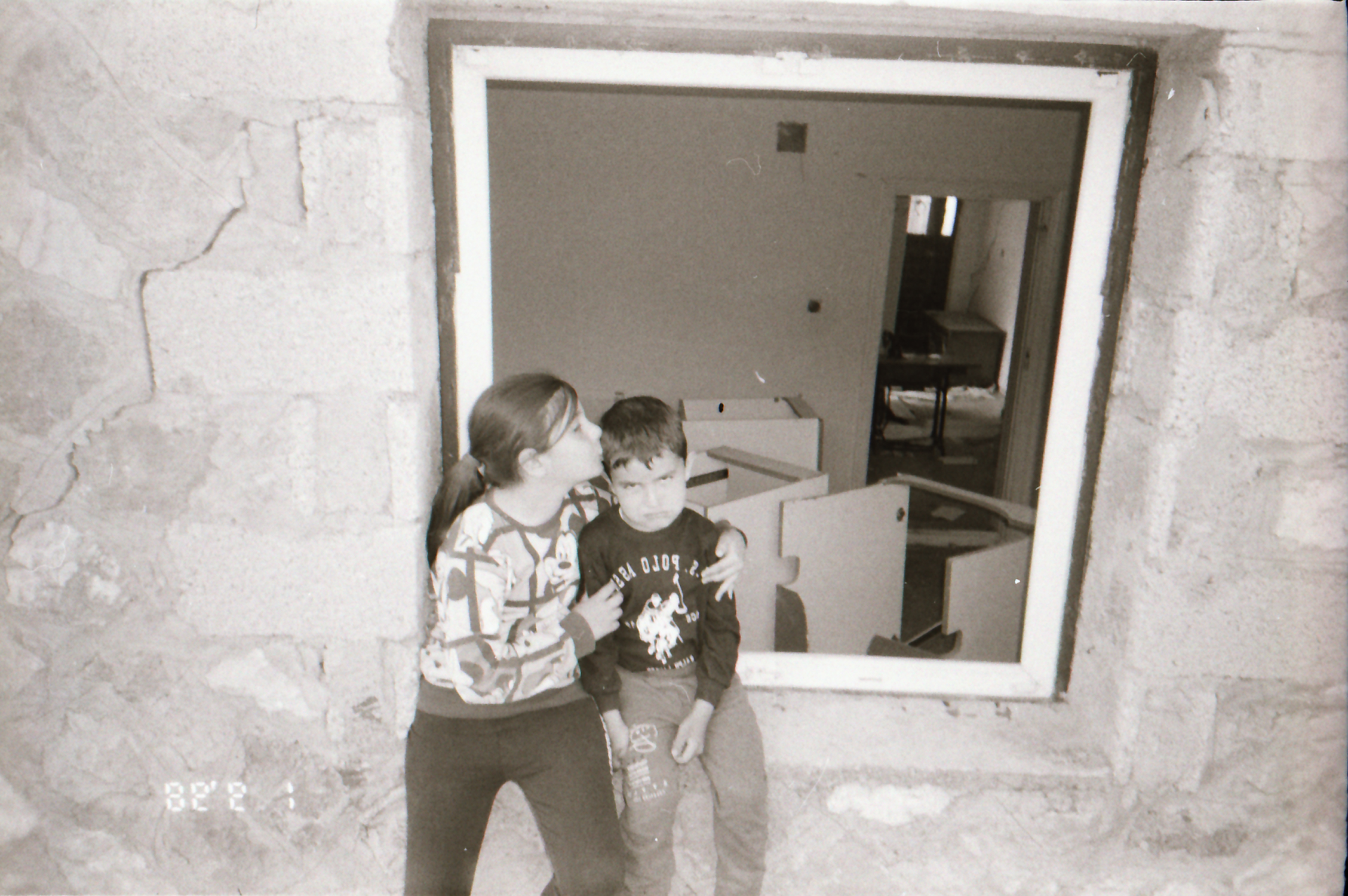 Girl kissing boy in front of window (Pic courtesy Sirkhane Darkroom)