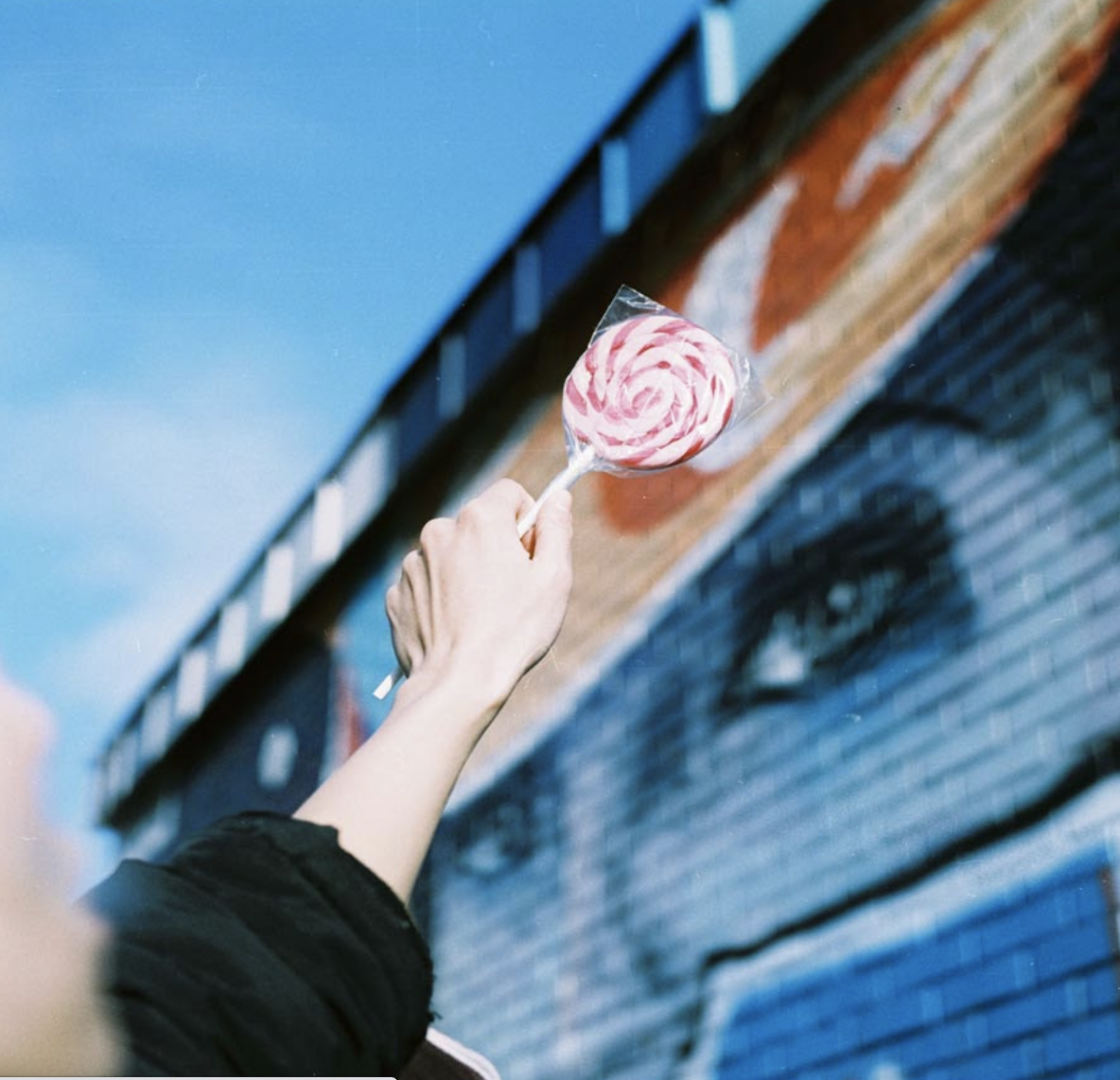 Woman holding giant lollipop (Pic: Courtesy Lomography)